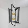 Alaska 8-Light Black/Gold Lantern and Candle Style Geometric Black and Gold Chandelier With Wrought Iron Accents by Maxax